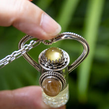 Load image into Gallery viewer, Fountain Sunset Rollerball Necklace Series - Amber &amp; Yellow Rutilated Quartz on Black Leaf Pattern
